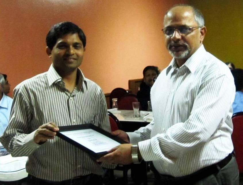 SPGNA Honorable Member of the Year: Prof. Subhashis Mallick (Univ. of Wyoming) presenting award to Dhananjay Kumar (Chevron)